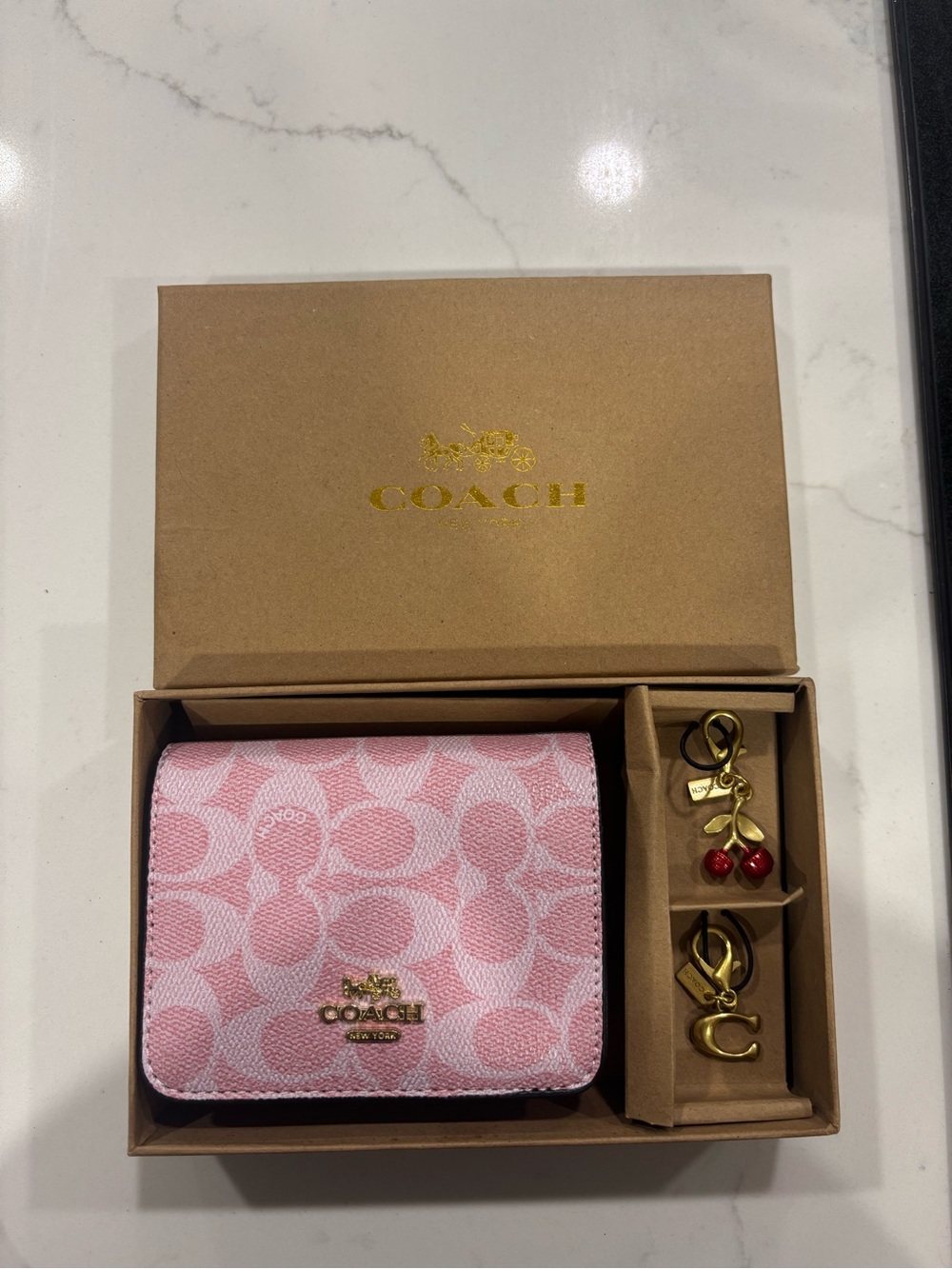 Coach Pink Signature Compact Wallet with Gold Charm Accents